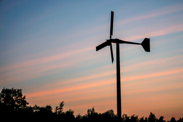 silhouette of windmill with sunset