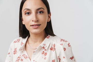 Photo of pleased beautiful woman posing and looking at camera