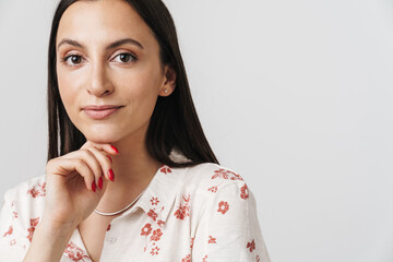 Photo of pleased beautiful woman posing and looking at camera