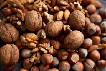 Mix of different nuts, background wiith walnuts, almonds and hazenuts