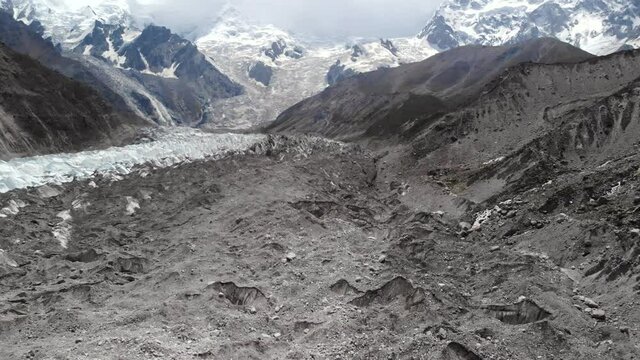 Rakhiot glacier on the feet of Nanga Parbat mountain, aerial view of the morraine composed of rocks and ice, popular trekking destination, Giglit Baltistan region, Pakistan 