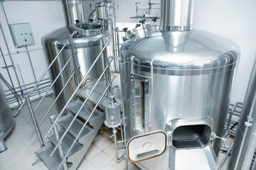 Two mash-tubs on beer-making plant, toned