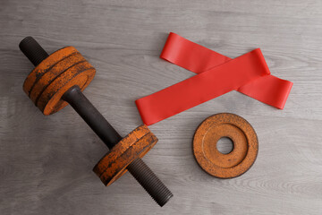 old sports equipment lies on the laminated floor, the top angle