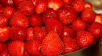 Lots of fresh strawberries. Peeled strawberry fruit.