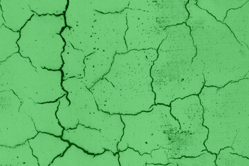 Green wall cracked. Abstract background.