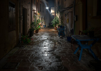 Fototapeta na wymiar Old town street at night after the rain