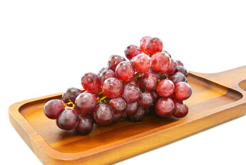 fresh grapes on Wooden tray with isolated white background