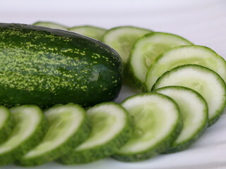 Fresh raw cucumber with sliced ones