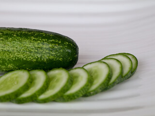 Fresh raw cucumber with sliced ones