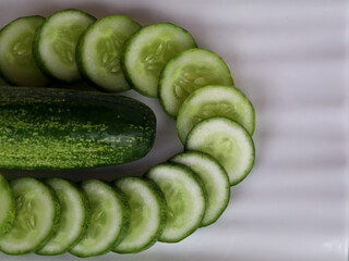 Fresh raw cucumber with sliced ones