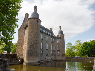 The castle of Flers, now a history museum (Normandy, Orne, France). Beautiful medieval architecture.  Historical monument. Surrounded by a moat. Sunny day.