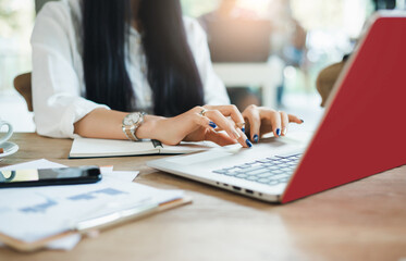 Close-up of hand young asian woman using laptop working and meeting online from home