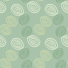 Geometric pattern in pastel colors. Yellow, white and green spirals on light green background.