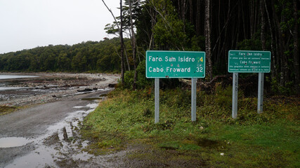 Misty ocean and tree landscape on a rainy day at Cape Froward on the Magellan Strait near Punta...