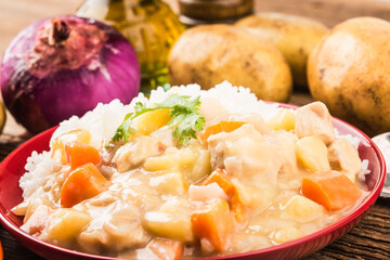 Chicken breast rice cooked with cheese potatoes and carrots
