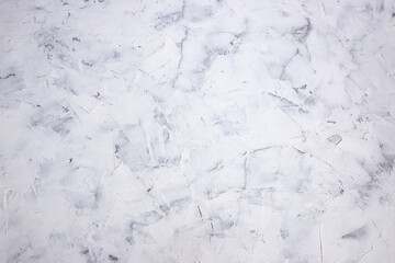 Vintage white concrete or cement background with trowel stains. Putty strokes in a chaotic manner.