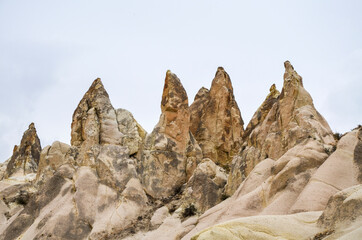 Photo of beautiful unique Mountain landscape with fairy chimneys in Goreme, Cappadocia, Turkey
