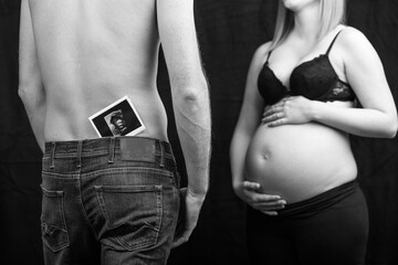 pregnant couple in love with baby belly