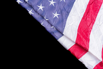 US American flag on black background. For USA Memorial day, Presidents day, Veterans day, Labor day, Independence or 4th of July celebration. Top view, copy space for text.