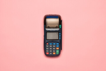 NFC payment contactless terminal on a pink background. Credit card or phone pay pos banking device,...