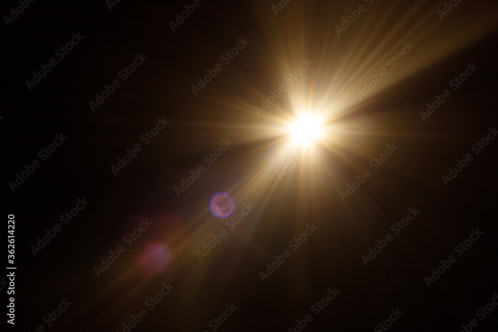 Poster Easy to add lens flare effects for overlay designs or screen blending mode to make high-quality images. Abstract sun burst, digital flare, iridescent glare over black background.