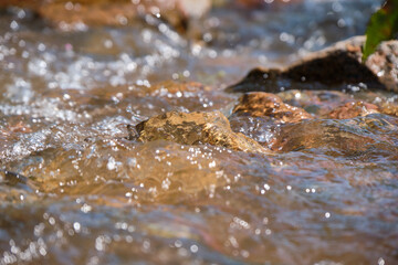 close up of water flowing into the water