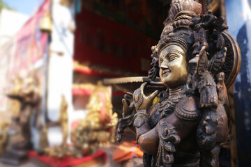 Fototapeta na wymiar Bronze statue of indian god Krishna.