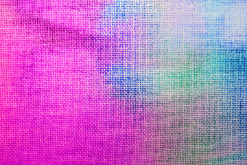 The texture of the canvas is painted. Canvas covered with a thin layer of paint in different colors.