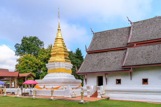 Golden pagoda and chapel at Wat Phra That Beng Sakat temple in Pua district, Nan province, Thailand