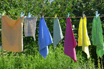 cleaning rags after cleaning handing outside in the summer sun