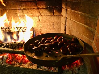 Roasting chestnuts in fire place 