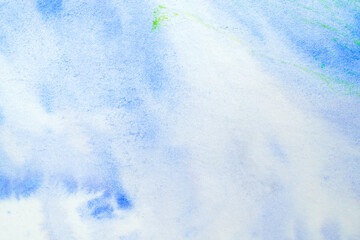 watercolor grunge background with drips of paint and spots in blue shades.