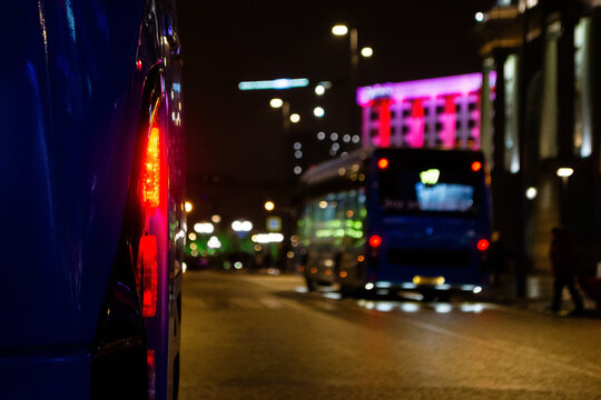 Lights of bus and electrobus in background