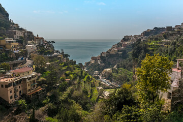 Fototapeta na wymiar A glimpse of the sea through the V-shaped ravine at Positano on the Amalfi coast, Italy