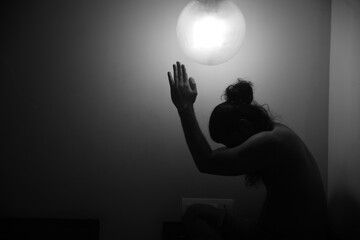 silhouette of a man in a light