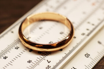 Wedding ring on the measuring instrument, macro