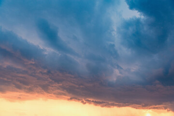 Dark storm clouds before the rain at sunset.