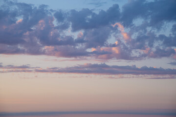 Beautiful orange blue  pastel colors clouds at blue hour after sunset.