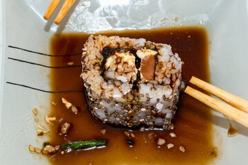 Japanese sushi food is excellent. Maki and rolls with tuna, salmon and avocado. Top view of sushi roll. wasabi.Selective focus.