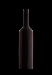 A bottle of red wine on a black background close-up.
