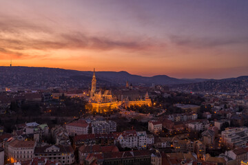 Aerial drone shot of Matthias Church on Buda hill during Budapest sunset