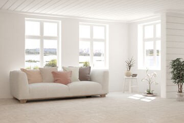 White living room with sofa and summer landscape in window. Scandinavian interior design. 3D illustration