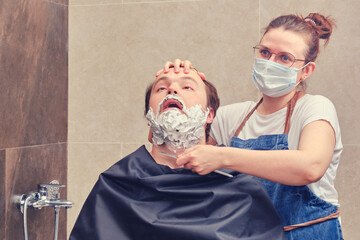 A woman held a beard shaving knife to a terrified man, the concept of injuries and danger