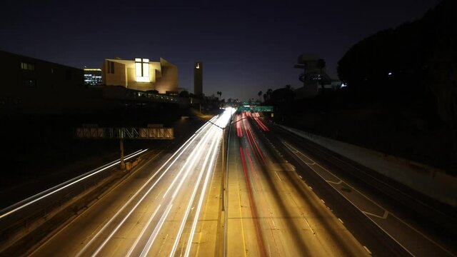 Los Angeles, California circa-2015 Time Lapse of Highway next to Cathedral of Our Lady of the Angels in Downtown Los Angeles 4K 3840x2160