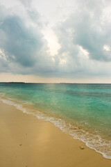 Cloudy skies on a beach in Dharavandhoo Maldives
