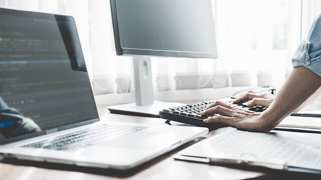 Programmer working in a software development and coding technologies. Website design. Technology concept.