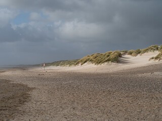 Sand dunes at Henne Beach and the North Sea.