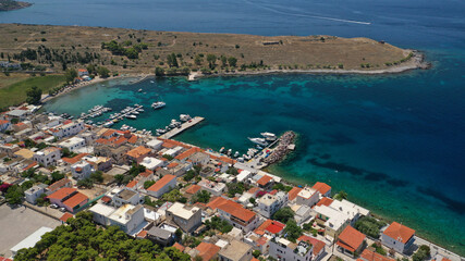 Fototapeta premium Aerial drone photo of picturesque fishing village of Perdika next to iconic small island of Moni, Aigina island, Saronic gulf, Greece