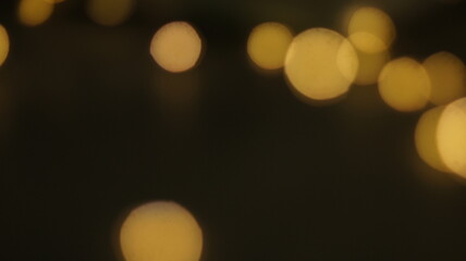 Natural Gold Color Bokeh Particles Effect Photo Overlays Background Glowing Abstract Lens Lights Defocused Circles and Blur Golden Glitter Beautiful Glamour Style. Use Screen Overlay Mode.