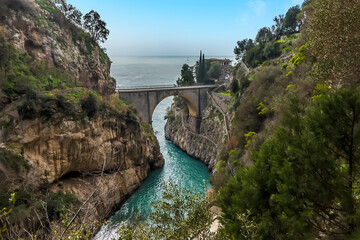 Looking down at the arched bridge and the fjord at Fiordo di Furore on the Amalfi Coast, Italy